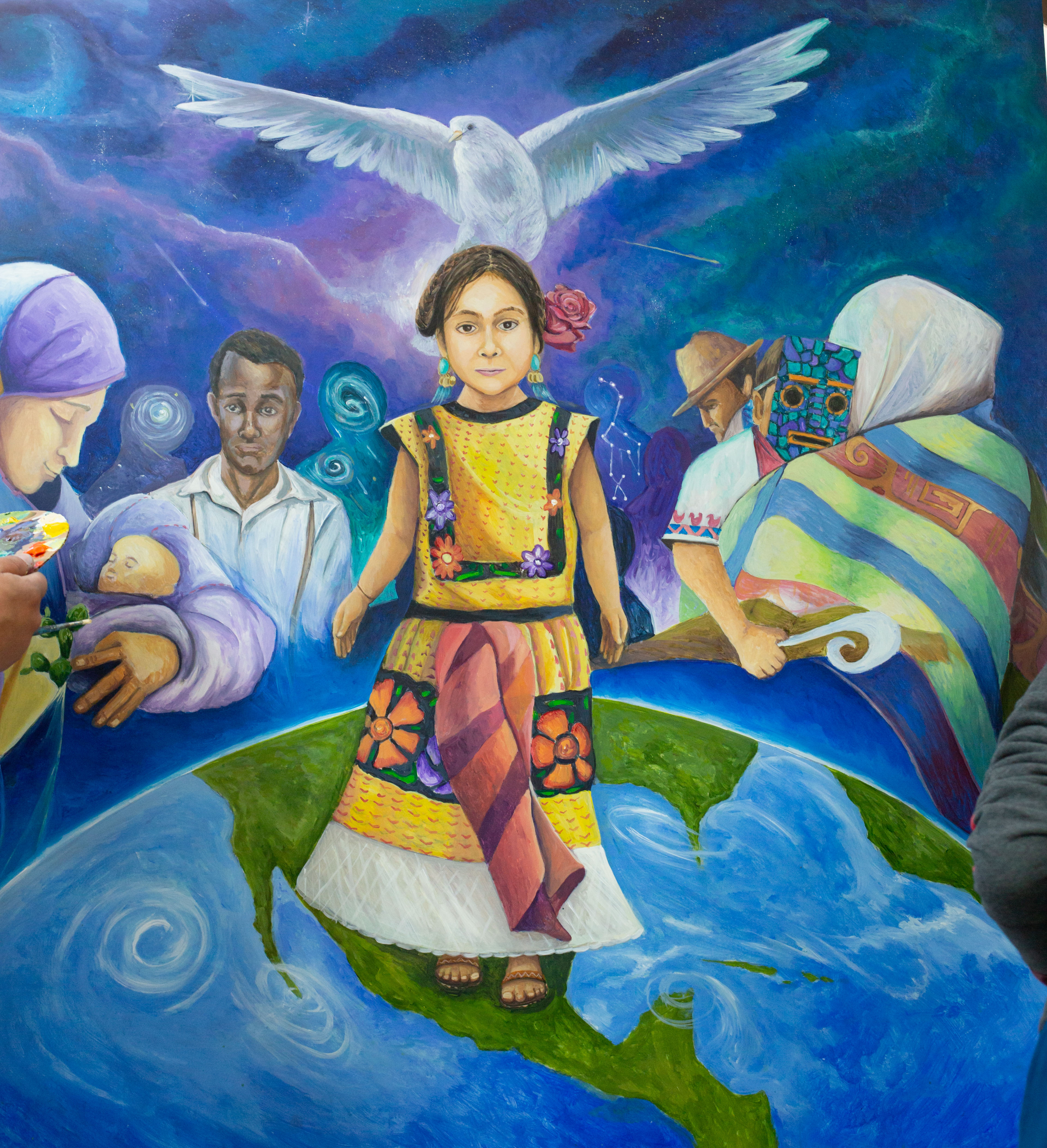 Image of young migrant child from Canal Alliance mural