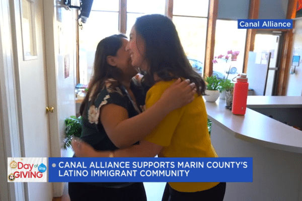 Canal Alliance workers hug
